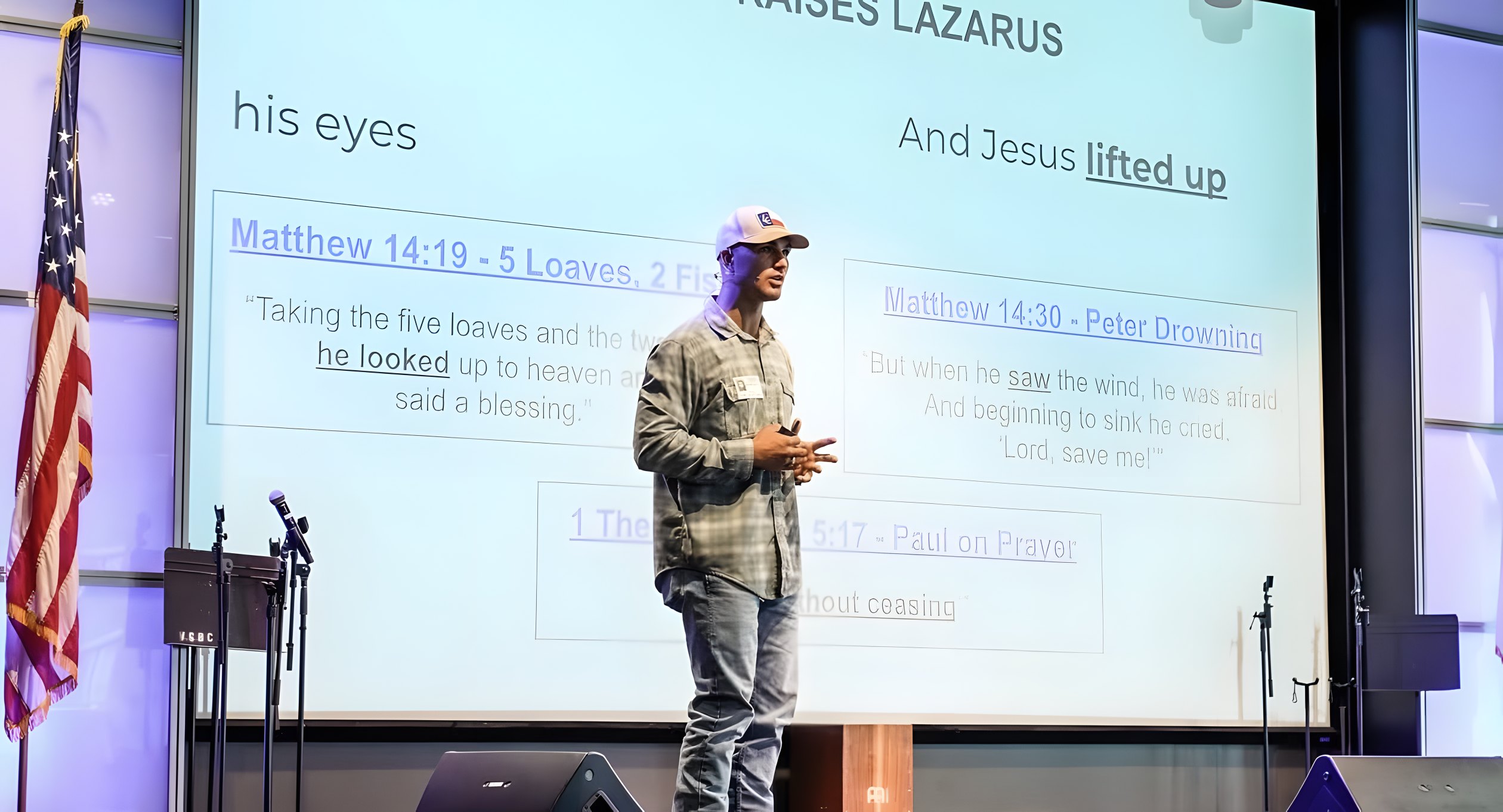 Randell speaking on stage